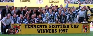 The Kilmarnock team celebrate with the trophy.