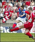 Chris Morgan wins the cup for Linfield